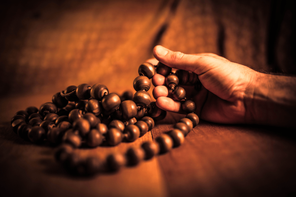Chanting Mantras with meditation beads...